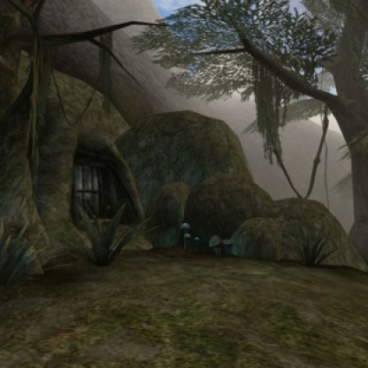 The entrance to a cave dwelling lies among the trees and mushrooms of the Bitter Coast. (Image credit to Bethesda Softworks, retrieved from GOG.com's official Morrowind page)